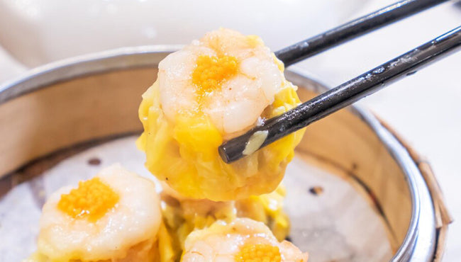 Ruokala steamer showcasing delicious dim sum with shrimp topping