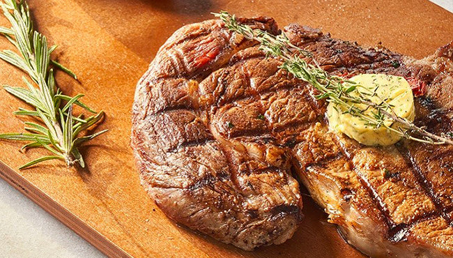 Perfectly grilled steak with herbs for a gourmet meal at home