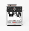 Front view of a high-end espresso machine with dual spouts and pressure gauge.