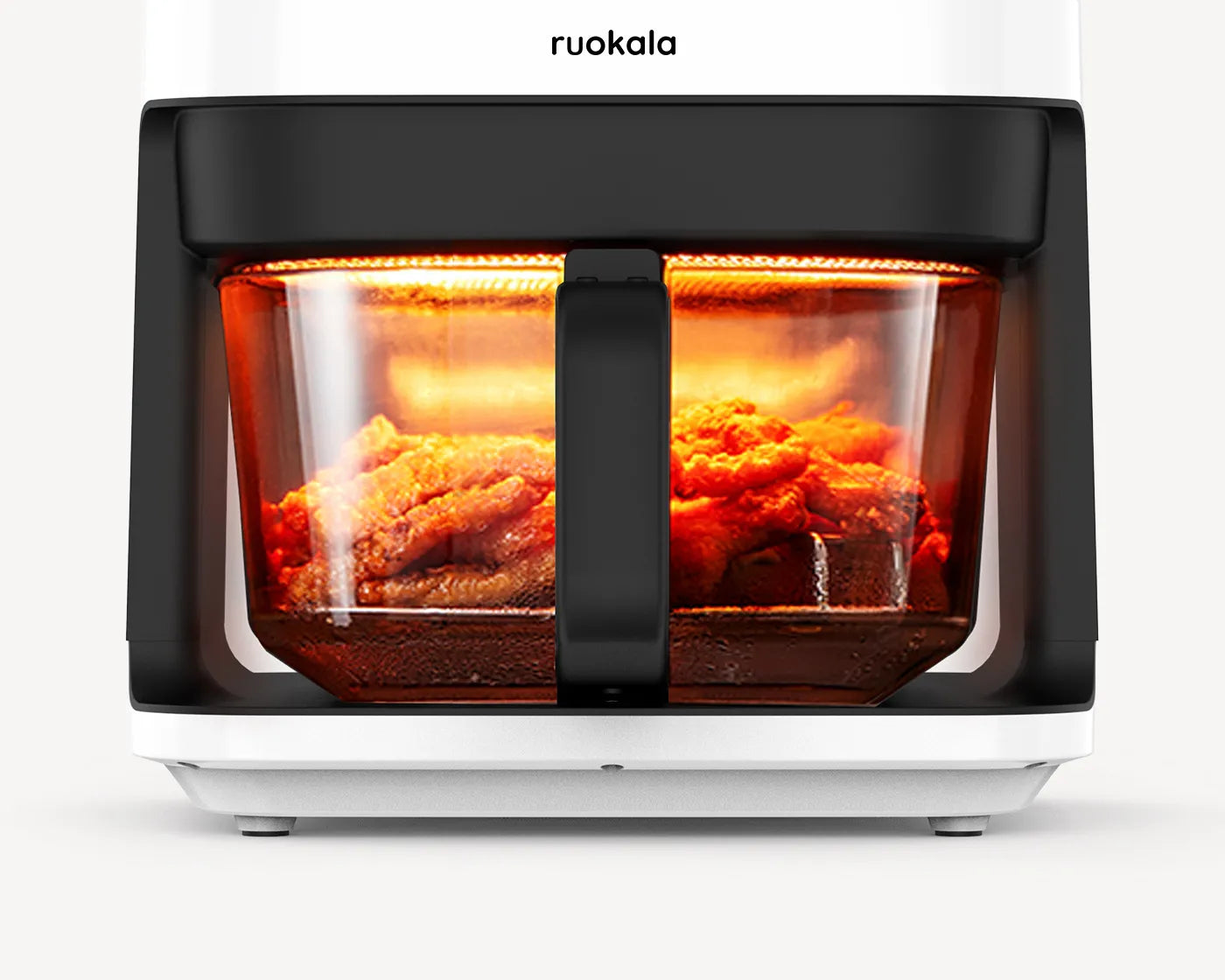 Sizzling chicken wings being cooked to perfection in a Ruokala air fryer, exemplifying convenient and healthy cooking.