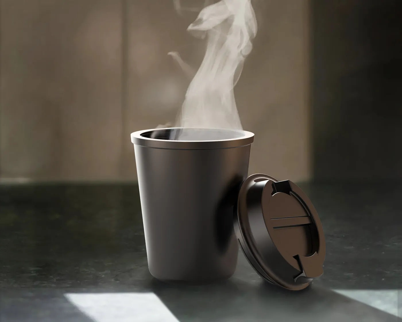 Steaming hot beverage in an open matte black travel mug on kitchen counter for morning coffee.